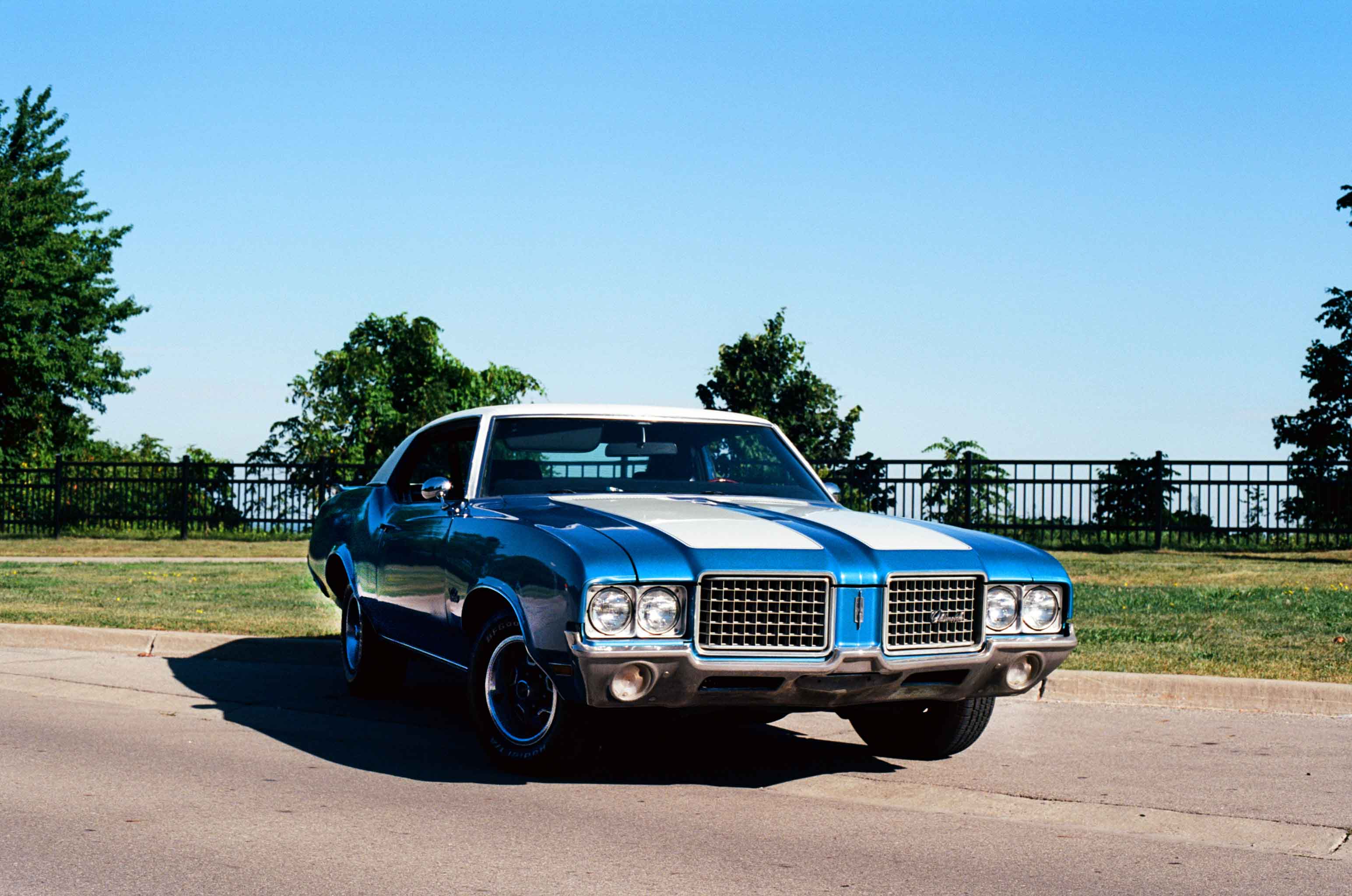 Blue Oldsmobile Cutlass Supreme