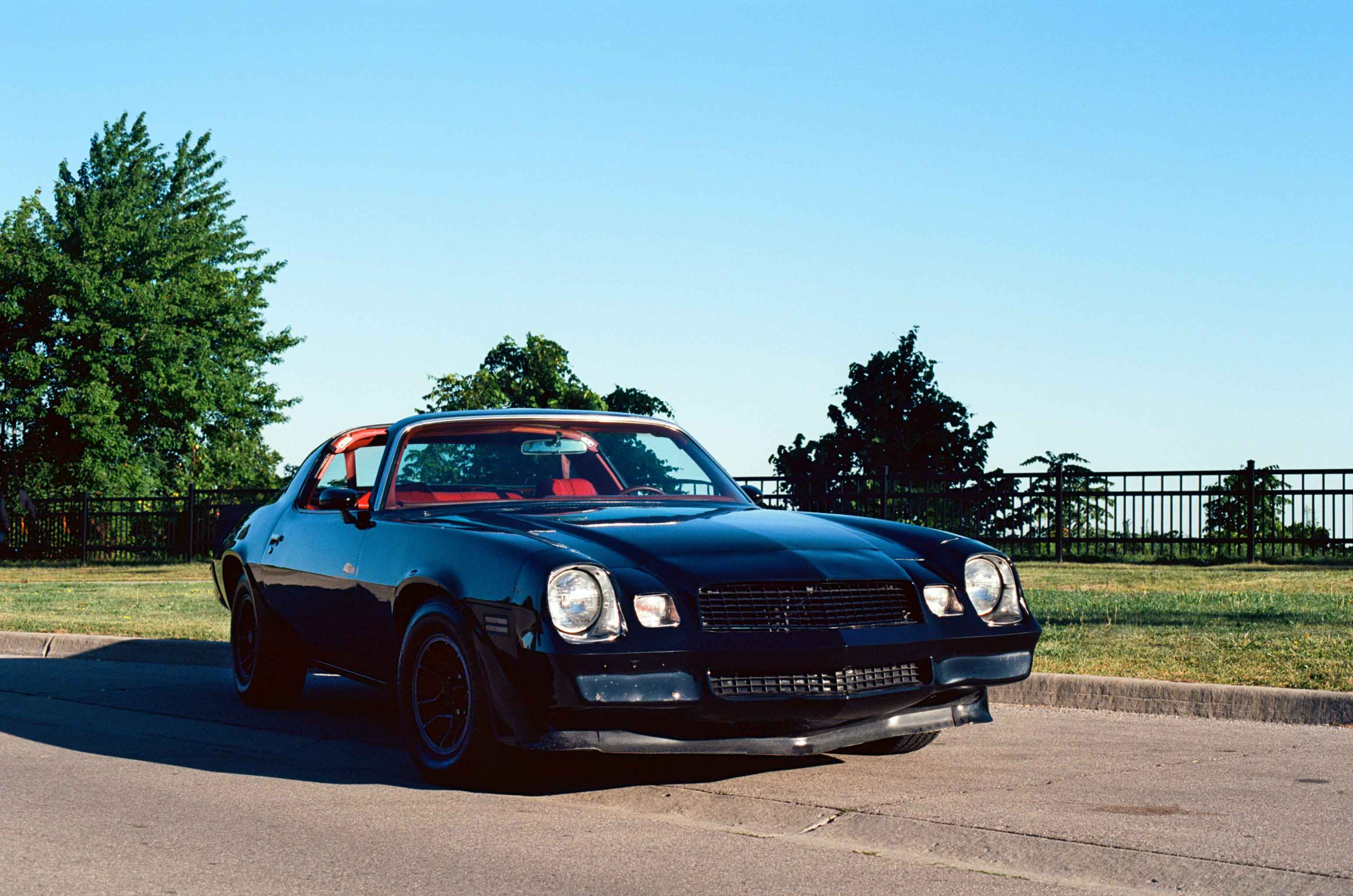 Black Cheverolet Camaro T Top